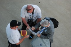 Coach signing some more autographs for the airport rescue squad...