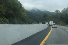 Heading down a steep grade but still can admire the clouds obscuring the tops of the mountains... Heading down a steep grade but still can admire the clouds obscuring the tops of the mountains...