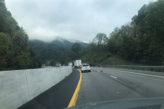 Heading down a steep grade but still can admire the clouds obscuring the tops of the mountains... Heading down a steep grade but still can admire the clouds obscuring the tops of the mountains...