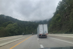 Heading down a steep grade but still can admire the clouds obscuring the tops of the mountains... Heading down a steep grade but still can admire the clouds obscuring the tops of the mountains...
