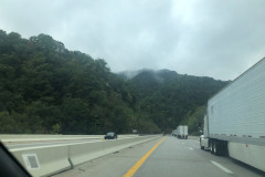 Heading down a steep grade but still can admire the clouds obscuring the tops of the mountains... Heading down a steep grade but still can admire the clouds obscuring the tops of the mountains...
