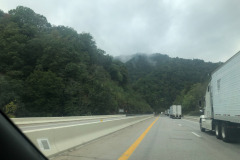 Heading down a steep grade but still can admire the clouds obscuring the tops of the mountains... Heading down a steep grade but still can admire the clouds obscuring the tops of the mountains...