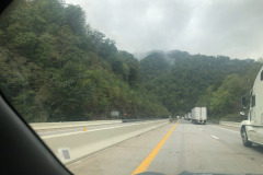 Heading down a steep grade but still can admire the clouds obscuring the tops of the mountains... Heading down a steep grade but still can admire the clouds obscuring the tops of the mountains...