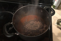 Drop the browned ground beef into the pot and let it simmer a bit to help infuse the flavour of the sauce. Drop the browned ground beef into the pot and let it simmer a bit to help infuse the flavour of the sauce.