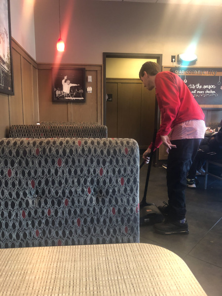 Alex doing a bit of tidying round the tables...