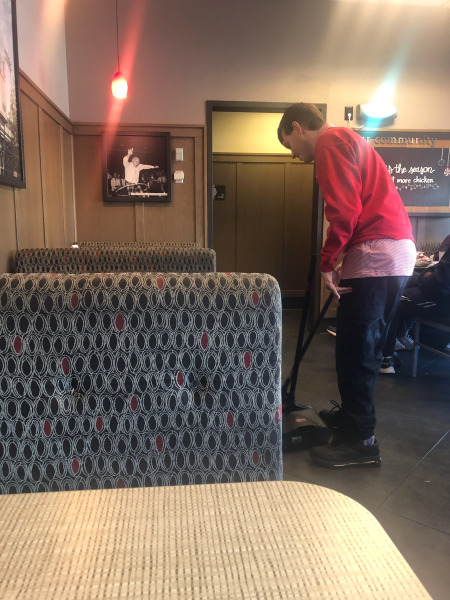 Alex doing a bit of tidying round the tables...