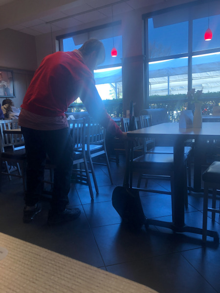 Alex doing a bit of tidying round the tables...