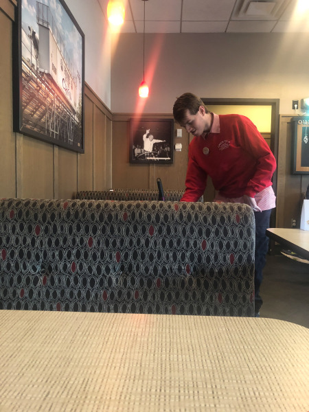 Alex doing a bit of tidying round the tables...