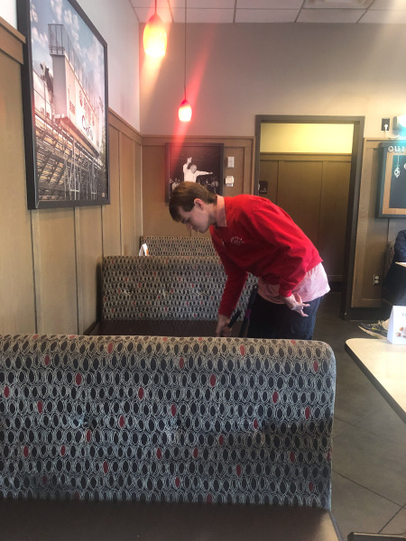 Alex doing a bit of tidying round the tables...