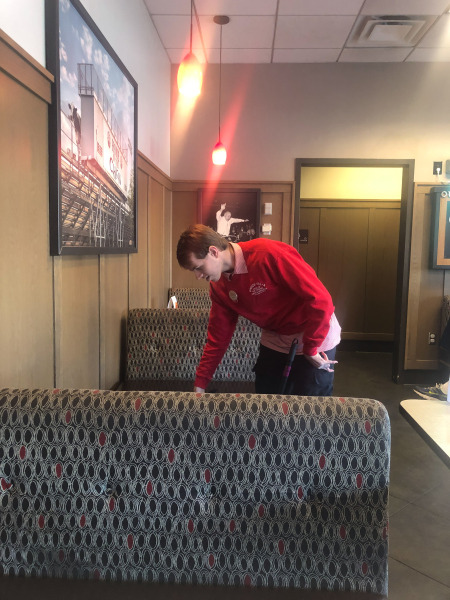 Alex doing a bit of tidying round the tables...